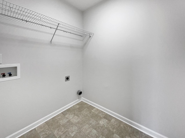 washroom with laundry area, hookup for a washing machine, baseboards, and hookup for an electric dryer