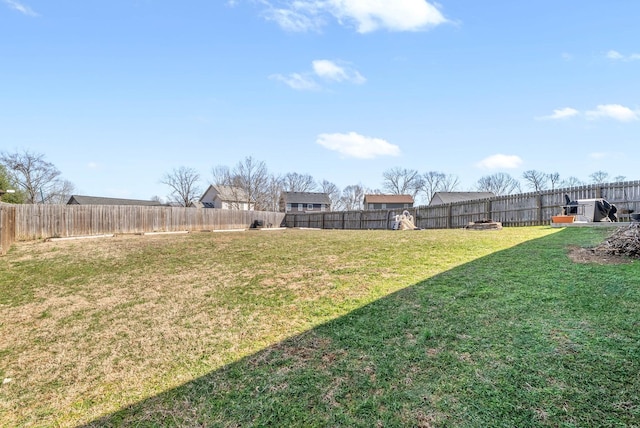 view of yard with a fenced backyard