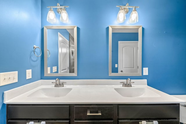 bathroom featuring double vanity and a sink