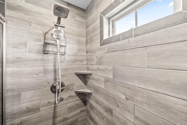 interior space featuring a tile shower