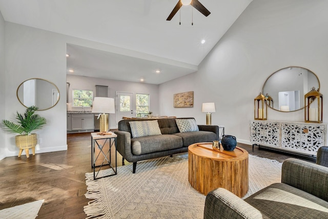 living room with ceiling fan, high vaulted ceiling, recessed lighting, wood finished floors, and baseboards