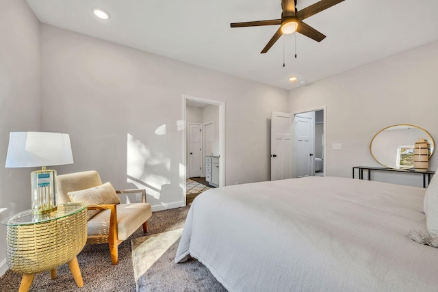 carpeted bedroom featuring baseboards, ceiling fan, ensuite bath, and recessed lighting