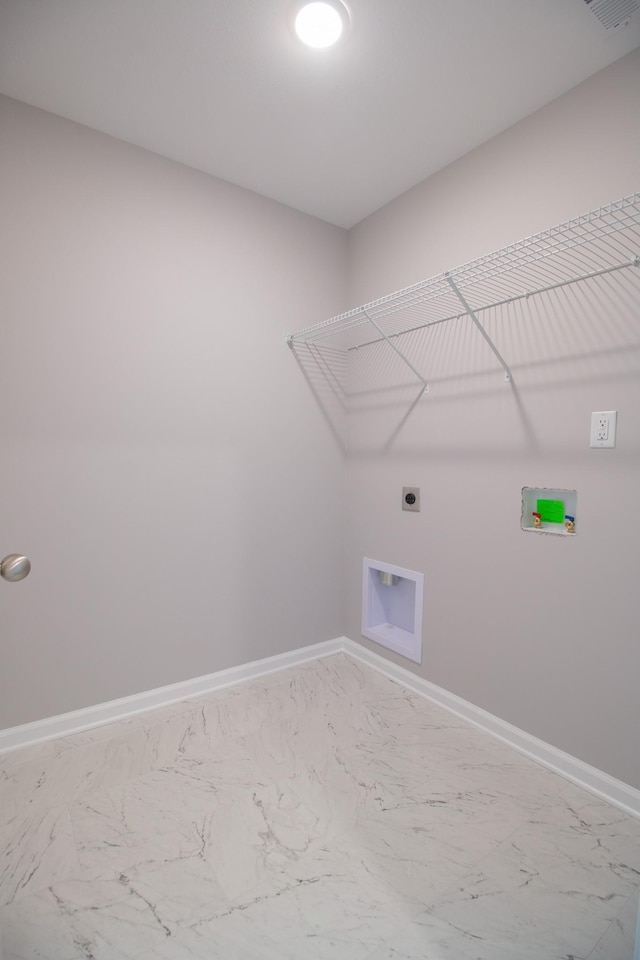 clothes washing area with marble finish floor, hookup for a washing machine, electric dryer hookup, laundry area, and baseboards