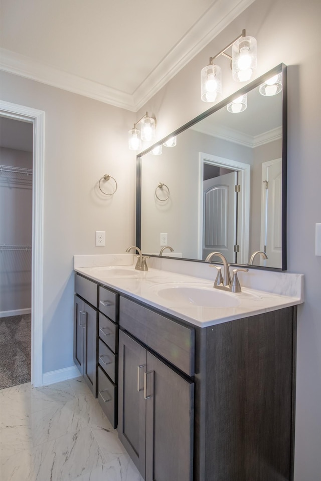 full bathroom with a sink, marble finish floor, double vanity, and crown molding