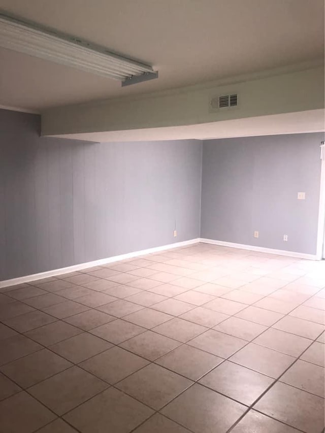 unfurnished room featuring visible vents and baseboards