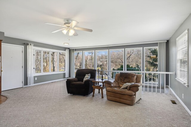 sunroom / solarium with ceiling fan and visible vents