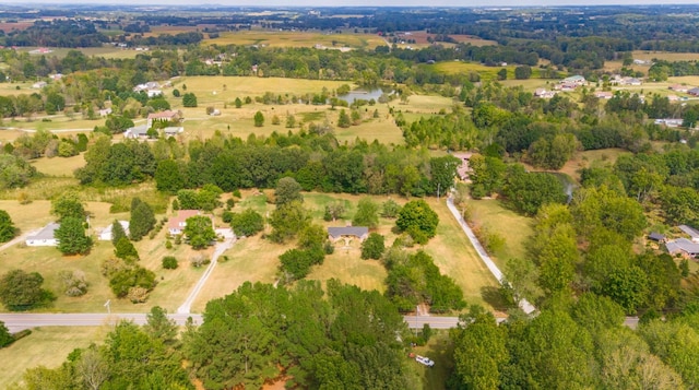 birds eye view of property with a rural view