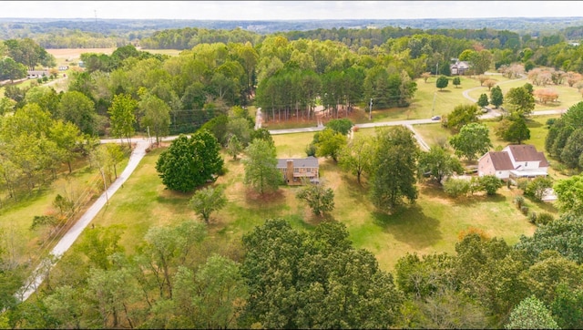 aerial view featuring a view of trees