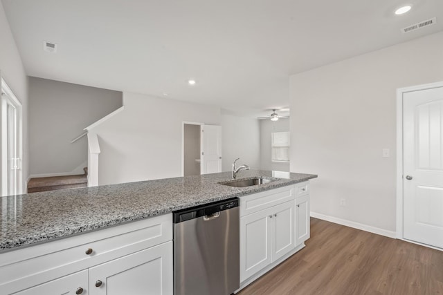 kitchen featuring a sink, visible vents, light wood-style floors, white cabinets, and dishwasher