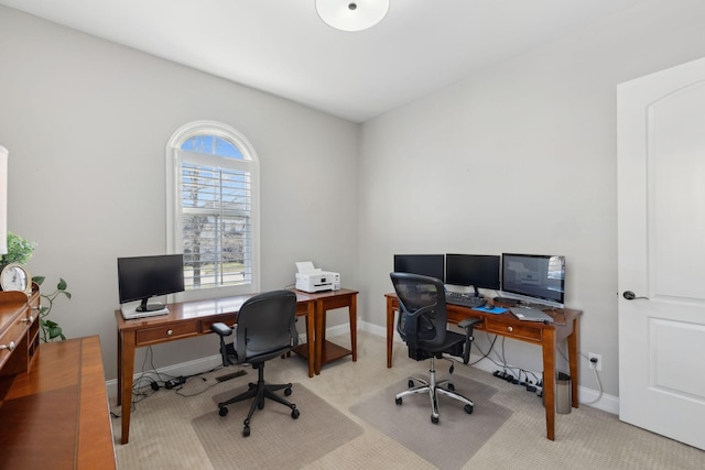 carpeted office space with baseboards