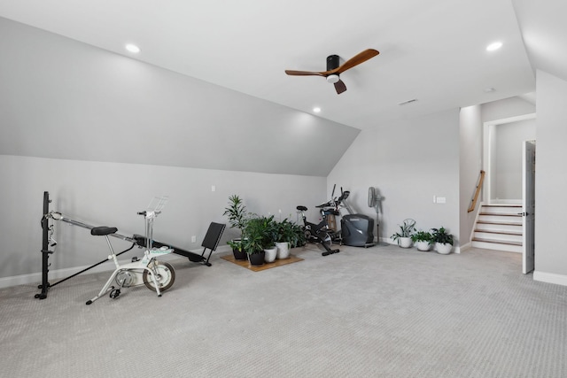 interior space with carpet, vaulted ceiling, baseboards, and recessed lighting