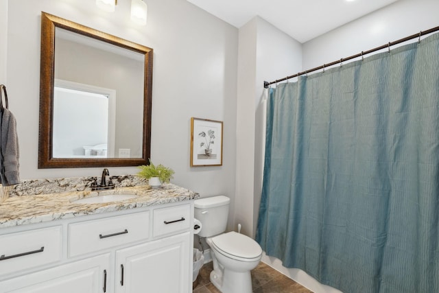 full bath with toilet, curtained shower, tile patterned flooring, and vanity