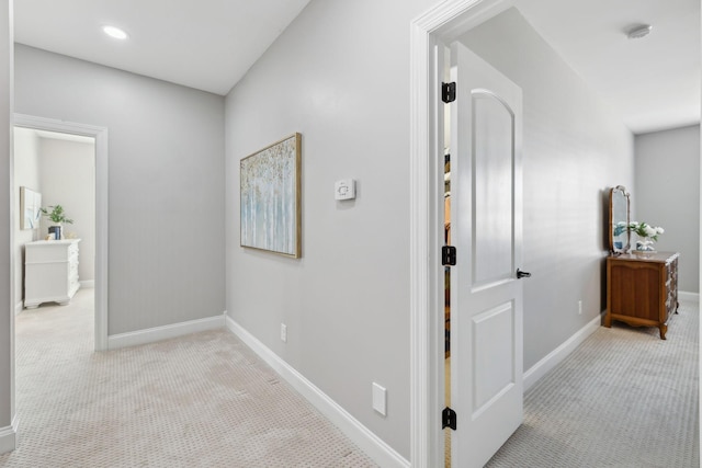 hallway featuring carpet floors, recessed lighting, and baseboards