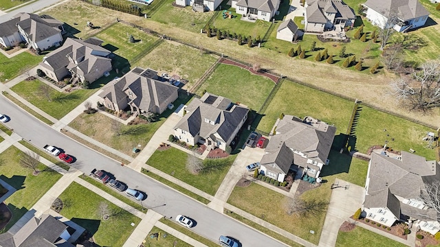 birds eye view of property with a residential view