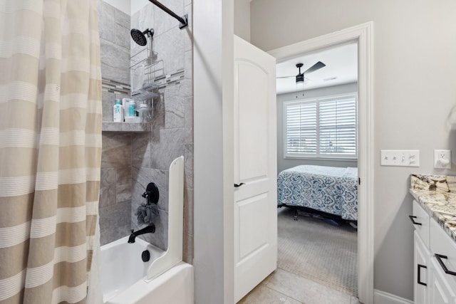 ensuite bathroom with a ceiling fan, ensuite bath, tile patterned flooring, shower / bath combination with curtain, and vanity