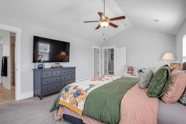 bedroom featuring light carpet, vaulted ceiling, visible vents, and a ceiling fan