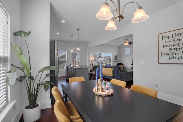 dining space with baseboards, dark wood finished floors, a ceiling fan, and recessed lighting