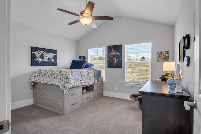 carpeted bedroom featuring ceiling fan, baseboards, and vaulted ceiling