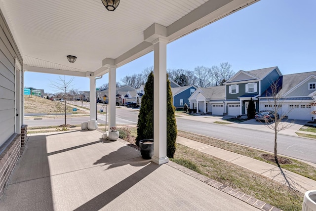 view of patio with a porch and a residential view