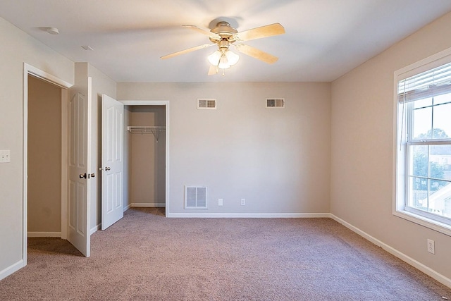 unfurnished bedroom with visible vents and multiple windows