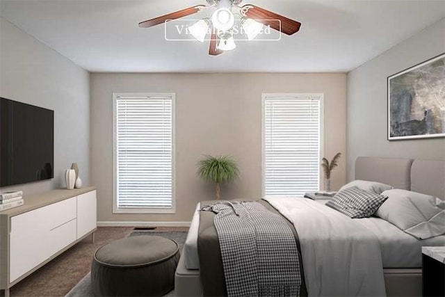 carpeted bedroom featuring ceiling fan and baseboards