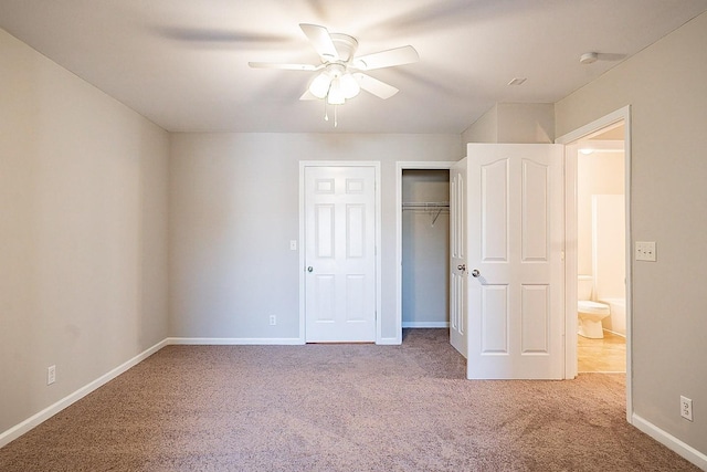 unfurnished bedroom with a ceiling fan, a closet, carpet flooring, and baseboards