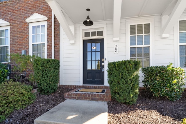 entrance to property with brick siding