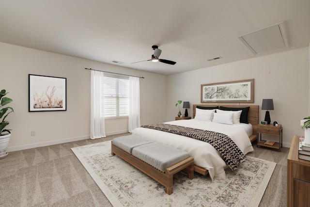 bedroom featuring attic access, visible vents, light carpet, and baseboards