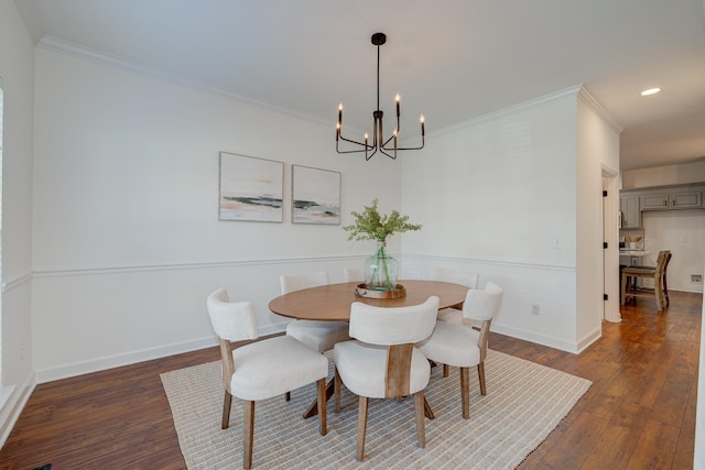 dining room featuring dark wood-style flooring, crown molding, and baseboards