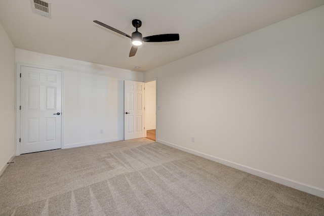 unfurnished bedroom featuring a ceiling fan, baseboards, visible vents, and carpet flooring