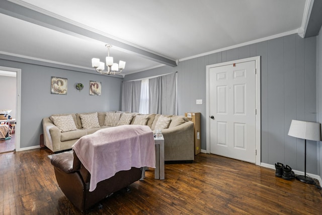 living area featuring crown molding, wood-type flooring, an inviting chandelier, beamed ceiling, and baseboards