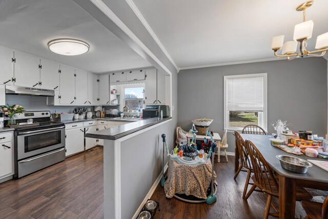 kitchen featuring under cabinet range hood, electric range, white cabinets, dark countertops, and dark wood finished floors