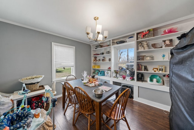 dining area featuring baseboards, a chandelier, dark wood-type flooring, and ornamental molding