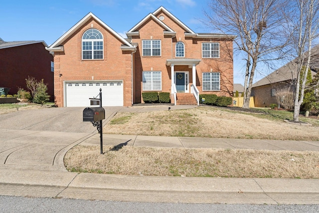 view of front of home featuring brick siding, an attached garage, and concrete driveway