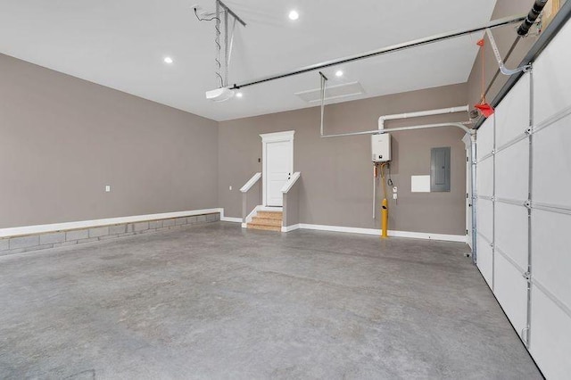 garage featuring electric panel and baseboards