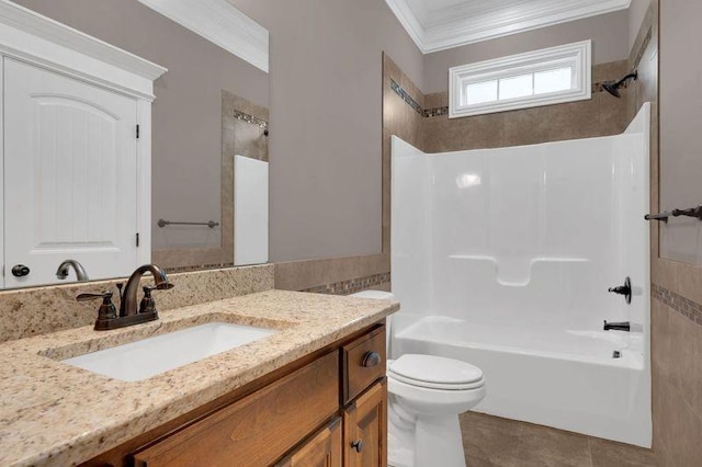 full bathroom featuring toilet, ornamental molding, tile patterned floors, vanity, and shower / washtub combination