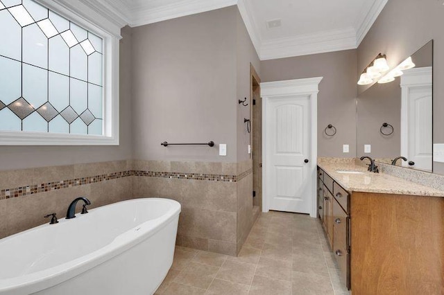 bathroom featuring tile patterned flooring, vanity, a freestanding bath, tiled shower, and crown molding