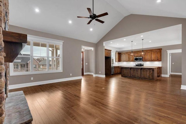 unfurnished living room with baseboards, a ceiling fan, dark wood-style flooring, high vaulted ceiling, and recessed lighting