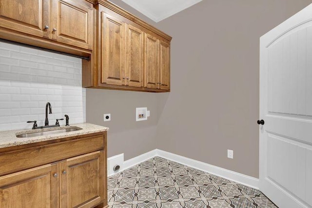 washroom with hookup for a washing machine, cabinet space, a sink, electric dryer hookup, and baseboards