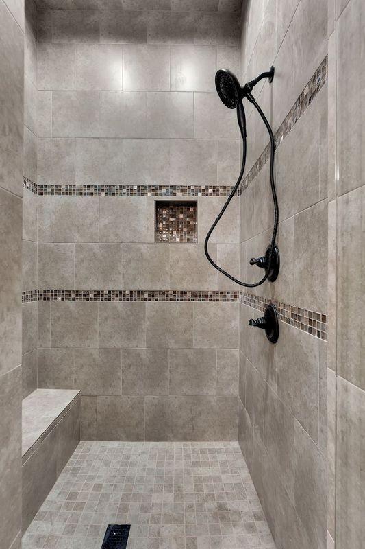 bathroom with tiled shower