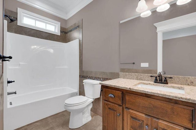 bathroom with toilet, tile patterned flooring, bathtub / shower combination, crown molding, and vanity