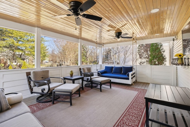 sunroom / solarium with wooden ceiling and ceiling fan