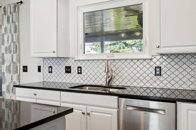 kitchen featuring a sink, white cabinetry, backsplash, and stainless steel dishwasher