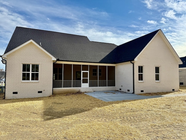 back of property featuring a sunroom, crawl space, and brick siding