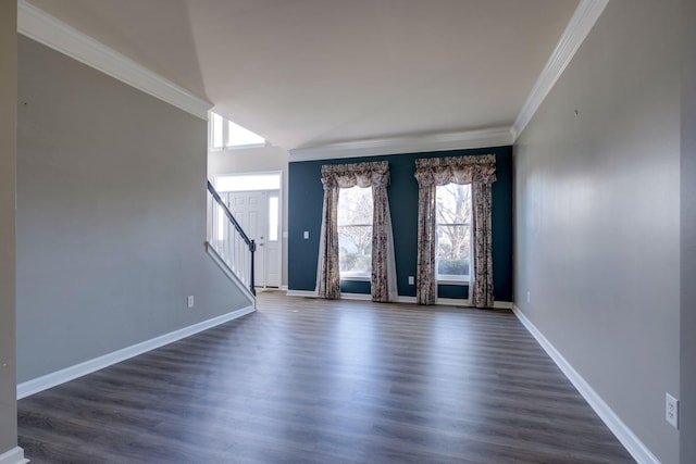 unfurnished room with ornamental molding, stairway, dark wood finished floors, and baseboards