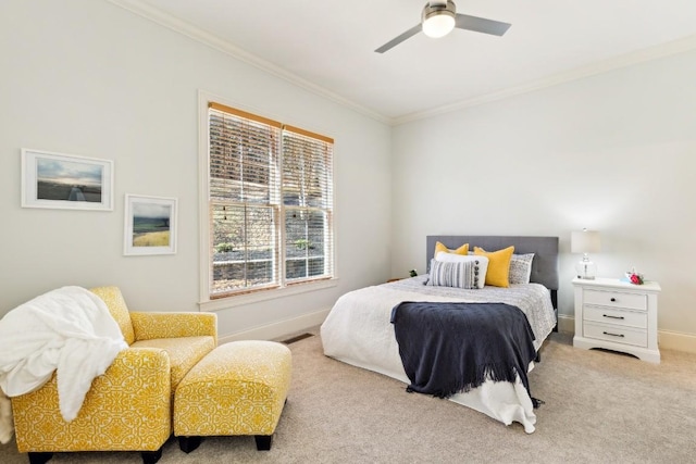 carpeted bedroom with ornamental molding, visible vents, baseboards, and a ceiling fan