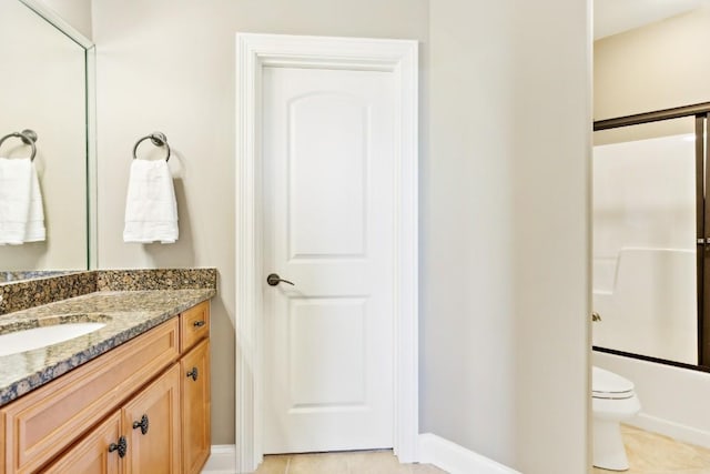 full bathroom with bathtub / shower combination, vanity, toilet, and tile patterned floors