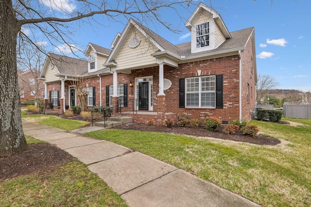 cape cod home with crawl space, brick siding, a front lawn, and fence