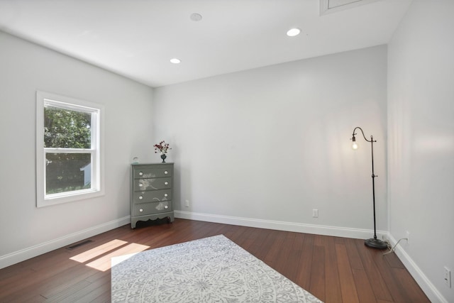 bedroom featuring dark wood-style floors, baseboards, visible vents, and recessed lighting