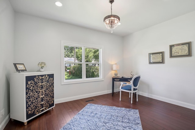 office with a chandelier, wood-type flooring, visible vents, and baseboards